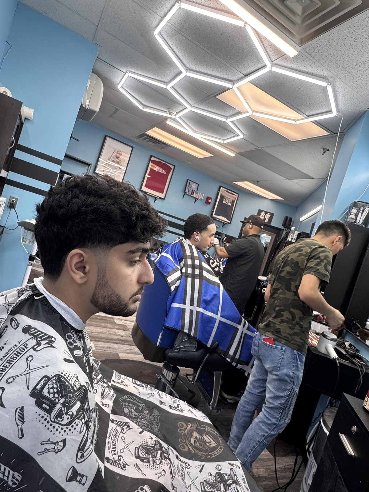 Inside Young Boys Barbershop on a busy afternoon